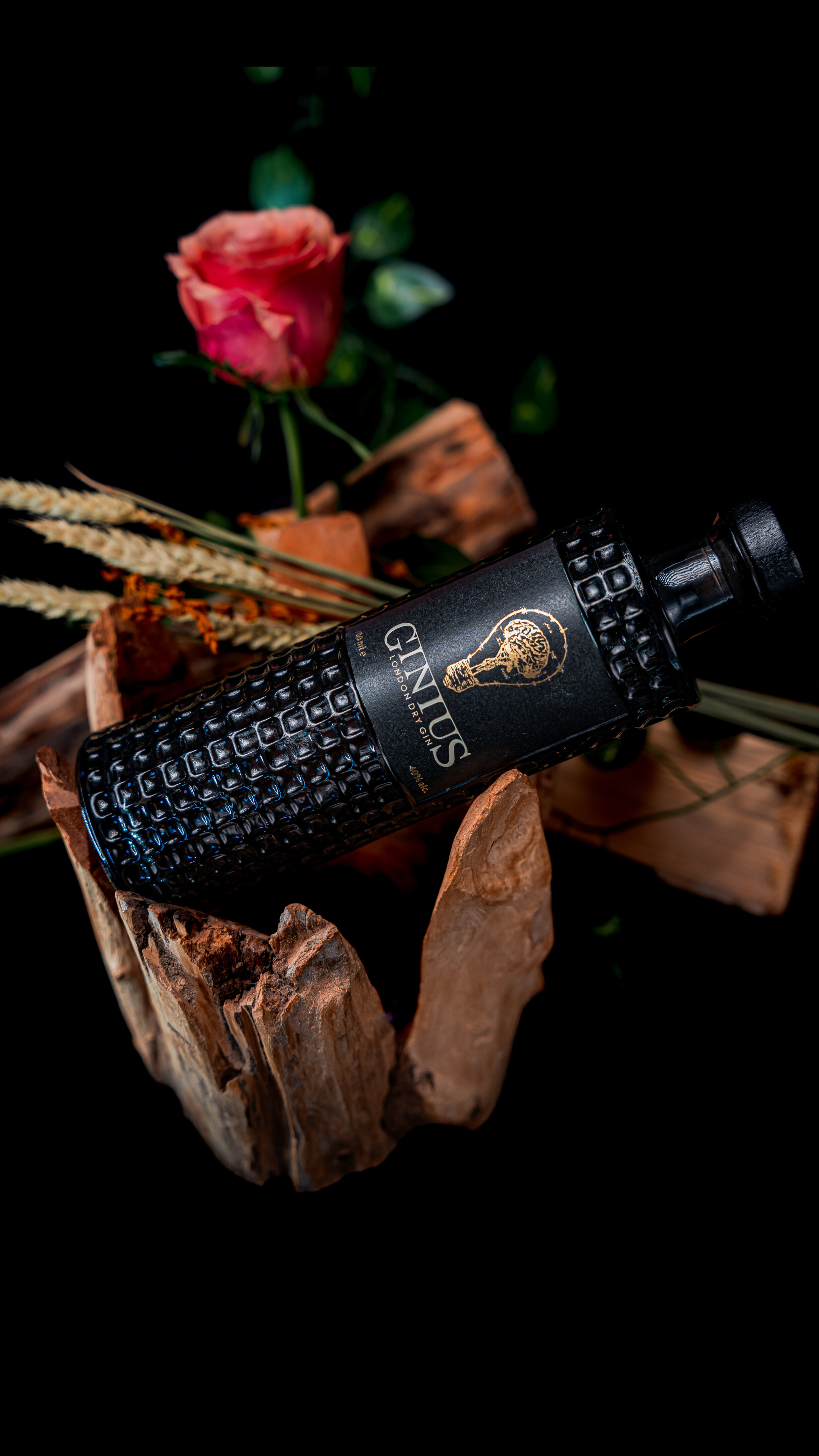 Ginius with botanicals rose mint and lemon in background