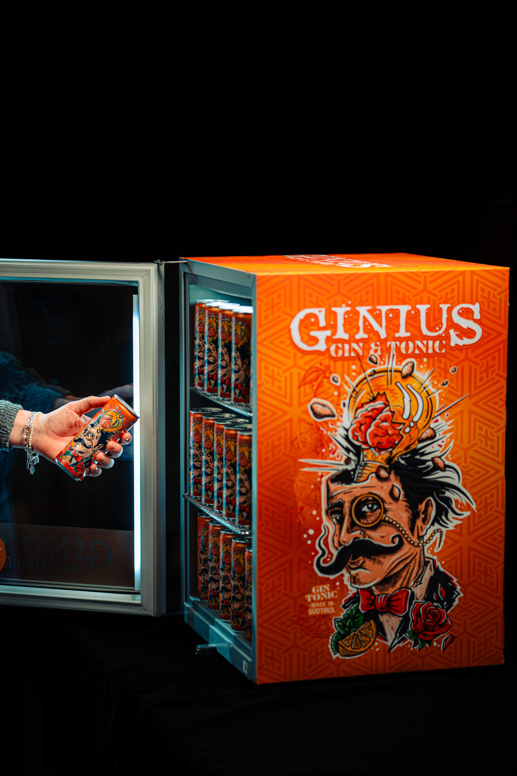 Ginius Gin & Tonic refrigerator with a person opening the door.